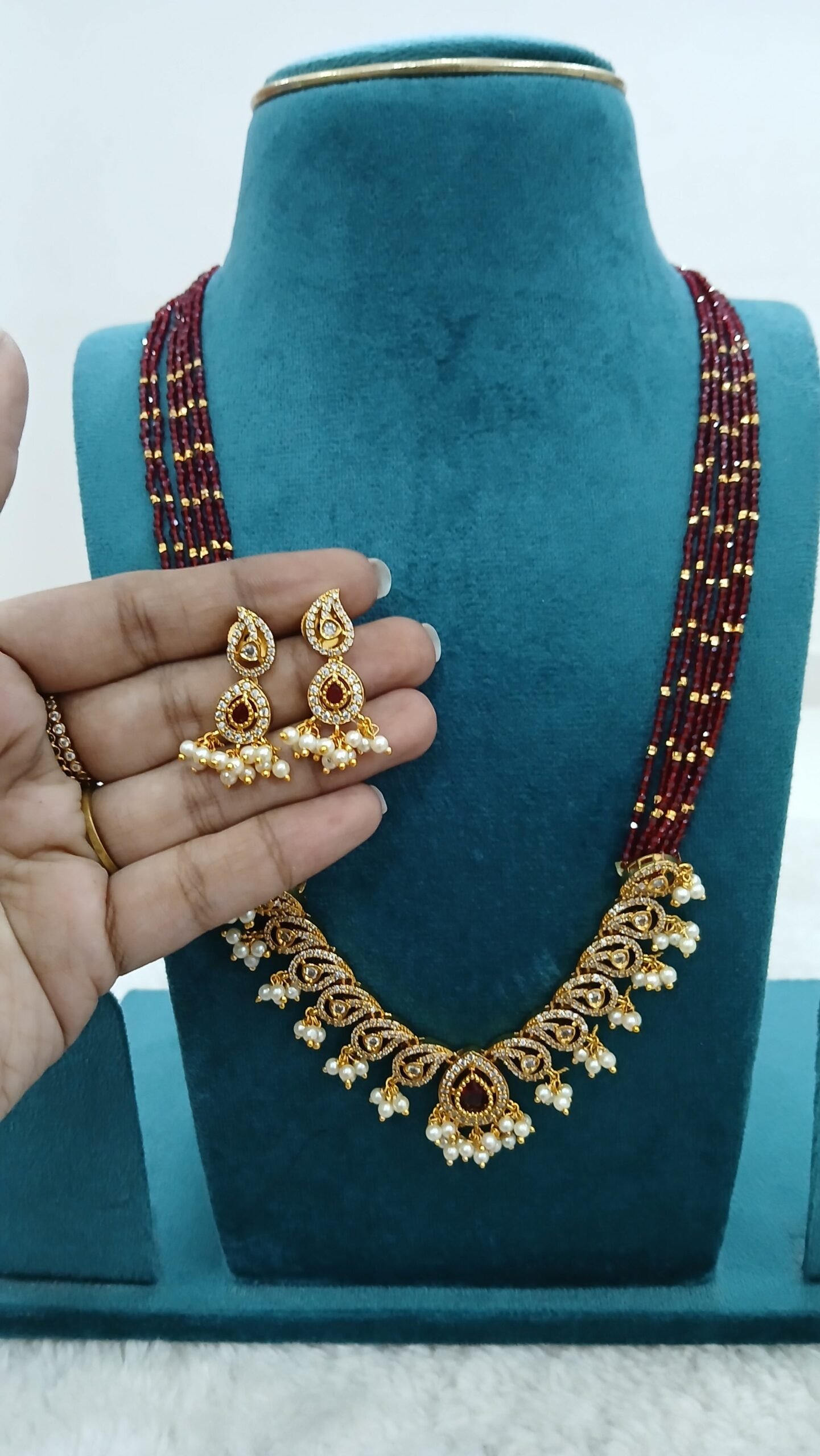 Red spinels with mango pendant and earrings