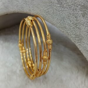 2.6 Round plain with gold ball detailing Micropolish bangles (set of 4)